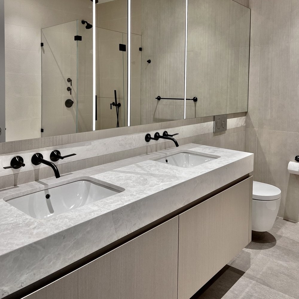 Marble bathroom vanity installation NYC with custom stone fabrication by Gurri Remodel