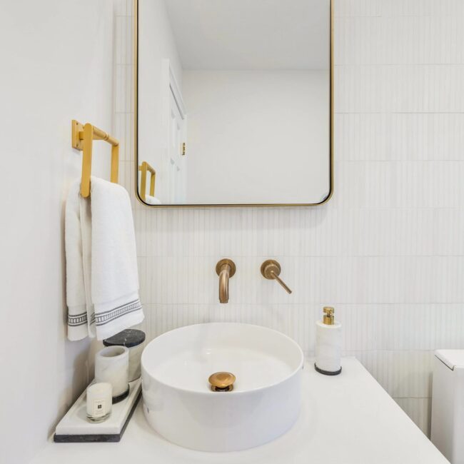 Bathroom vanity installation in NYC with custom cabinetry and modern finishes by Gurri Remodel