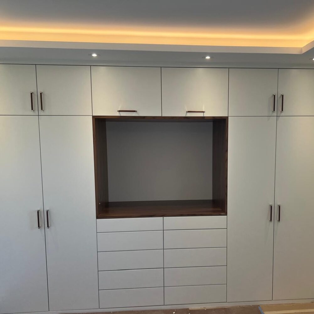 Custom shelving and wall unit millwork NYC with built-in storage by Gurri Remodel