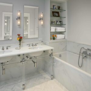Double vanity marble bathroom NYC with polished fixtures by Gurri Remodel