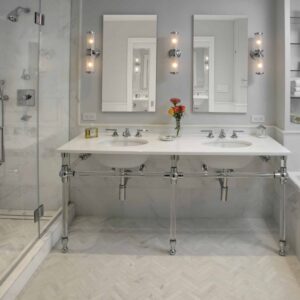 Luxury marble bathroom remodeling NYC with double vanity and high-end finishes by Gurri Remodel