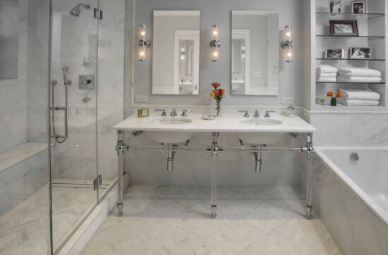 Luxury marble bathroom remodeling NYC with double vanity and high-end finishes by Gurri Remodel