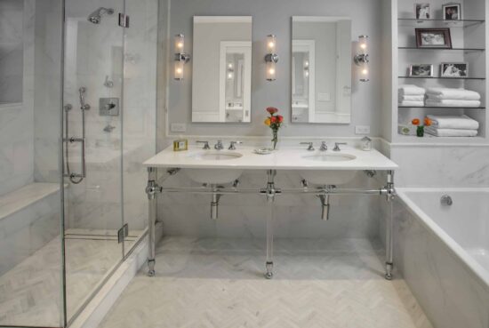 Luxury marble bathroom remodeling NYC with double vanity and high-end finishes by Gurri Remodel